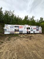Sponsorship signs by the boat launch.