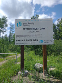 Sign at the Spruce River Dam on the south end of the lake.