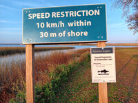 Speed restriction sign near the marina.