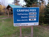 Camping fees sign.